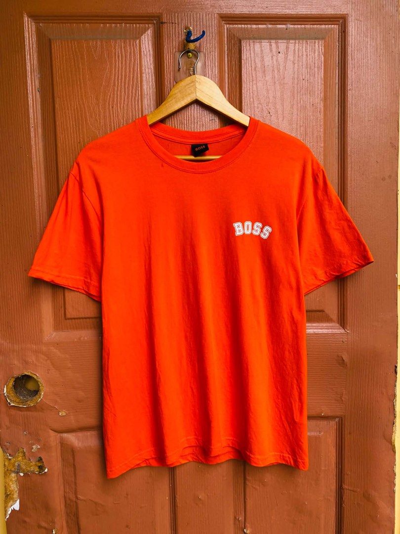 BOSS Orange T-Shirt Size M (Category: Tshirts & Polo Shirts ) located in Digos. Submitted by thrifthed.ph (Listing ID 1462666223, Image 2). Description: - Orange BOSS t-shirt -med -like new -cl:10/10 -authentic -dimes:20/28 -no issue -solid condi -solid colorate -authentic -suitable for picky buyer - - Features circular BOSS logo graphic on the back - Smaller BOSS logo on the chest - Made from comfortable material - Ideal for casual wear - Please