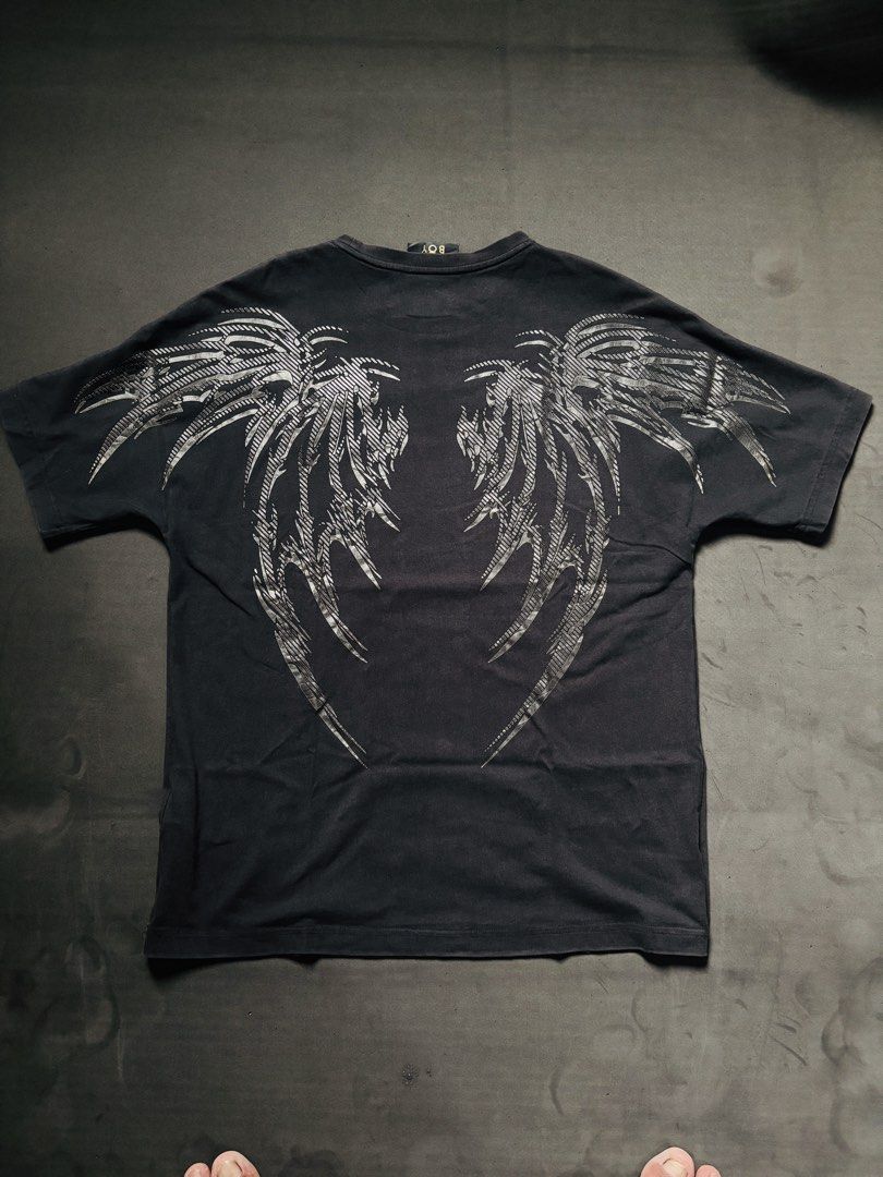 BOY London Graphic T-Shirt - Black (Category: Tshirts & Polo Shirts ) located in Manila. Submitted by erxm.thrift (Listing ID 1462572425, Image 2). Description: - Black BOY London t-shirt - Features iconic eagle logo on the front - Large graphic wings design on the back - Short sleeves and crew neck - Simple, bold style for casual wear.