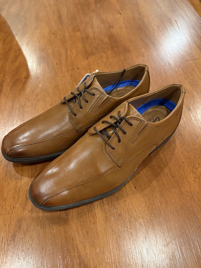 Brand New Clarks Leather Shoes (Category: Dress Shoes) located in Quezon City. Submitted by marcusssimeon (Listing ID 1462622802, Image 1). Description: - Brand: Clarks Collection - Model: Whiddon Pace - Color: Dark Tan Leather - Size: US 9.5 M - Material: Genuine Leather Upper - Comfort Tech: OrthoLite® cushioned footbed, molded heel support, and breathable lining - Outsole: High-traction rubber sole .