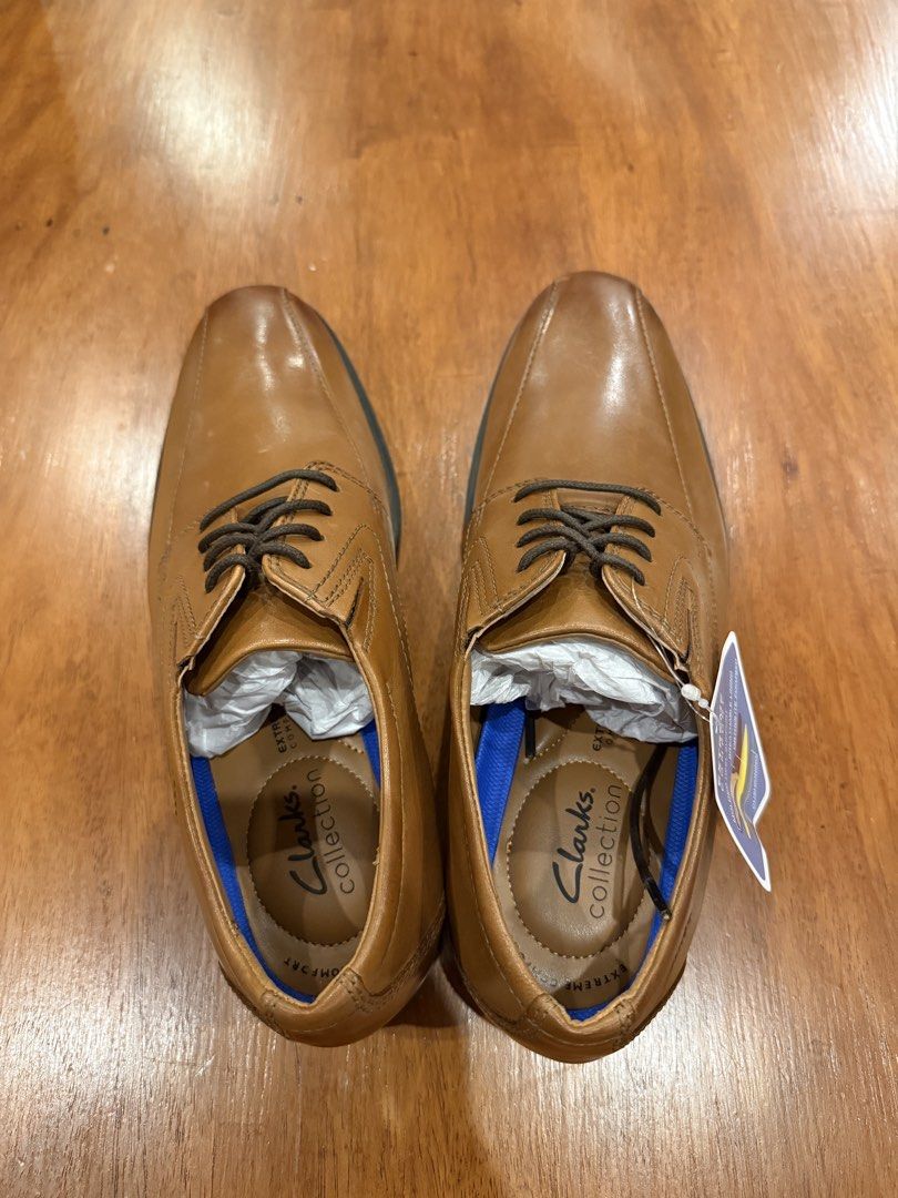 Brand New Clarks Leather Shoes (Category: Dress Shoes) located in Quezon City. Submitted by marcusssimeon (Listing ID 1462622802, Image 3). Description: - Brand: Clarks Collection - Model: Whiddon Pace - Color: Dark Tan Leather - Size: US 9.5 M - Material: Genuine Leather Upper - Comfort Tech: OrthoLite® cushioned footbed, molded heel support, and breathable lining - Outsole: High-traction rubber sole .