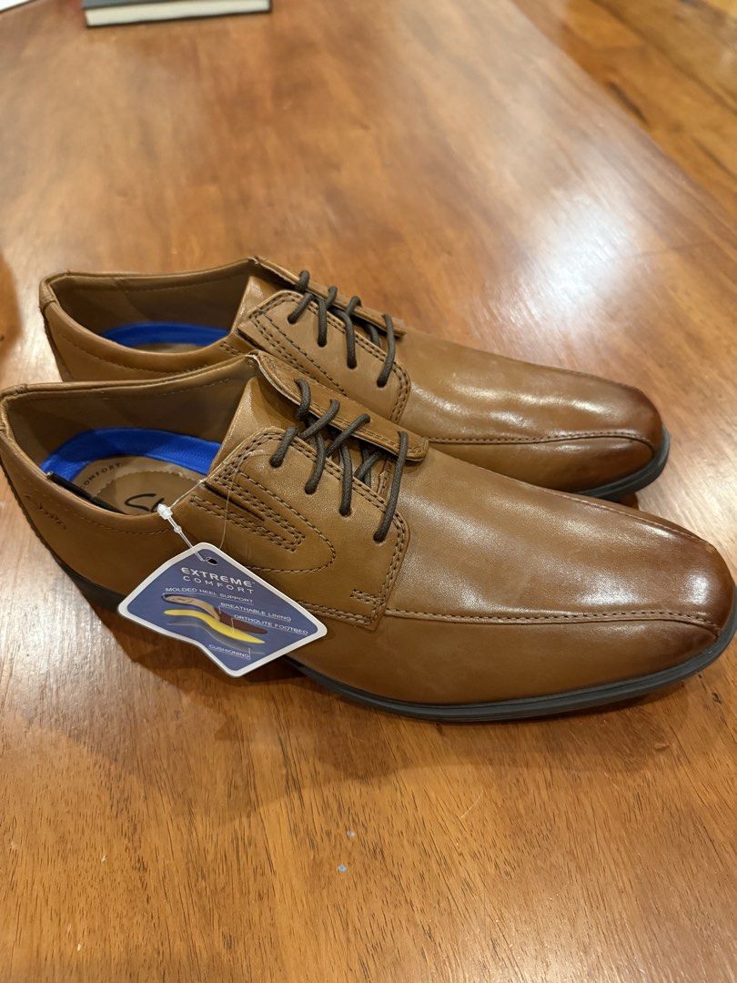 Brand New Clarks Leather Shoes (Category: Dress Shoes) located in Quezon City. Submitted by marcusssimeon (Listing ID 1462622802, Image 2). Description: - Brand: Clarks Collection - Model: Whiddon Pace - Color: Dark Tan Leather - Size: US 9.5 M - Material: Genuine Leather Upper - Comfort Tech: OrthoLite® cushioned footbed, molded heel support, and breathable lining - Outsole: High-traction rubber sole .