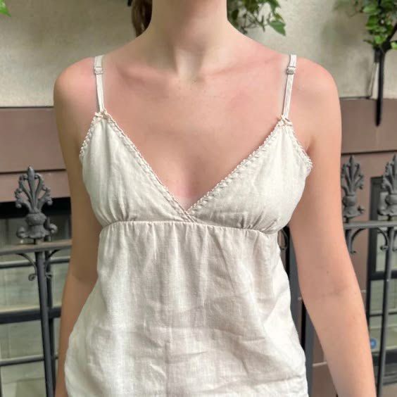 Brandy Melville Edith Linen Top (Category: Sleeveless) located in Muntinlupa City. Submitted by curytae (Listing ID 1462651562, Image 1). Description: - Lightweight linen blend fabric - Flattering V-neckline with delicate trim - Adjustable spaghetti straps for a perfect fit Only used once rfs: uncomfortable wearing it since it’s too revealing for my preference + not flattering for my body type.
