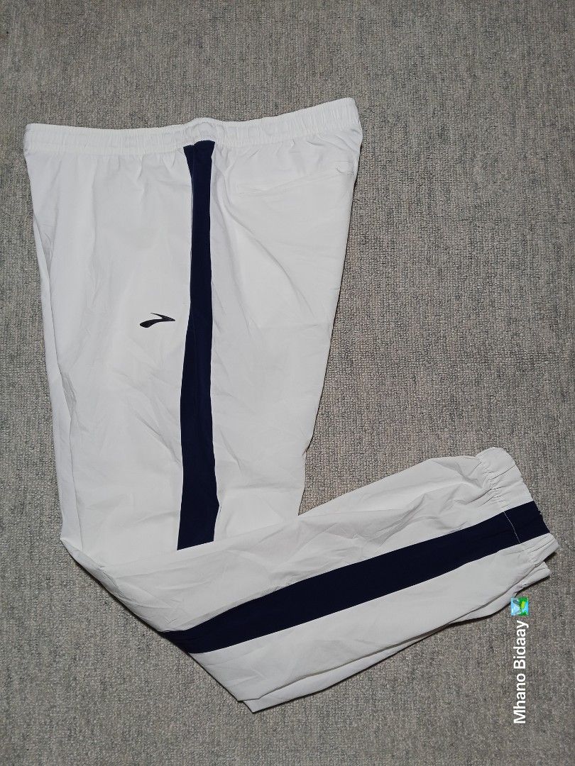 Brooks Men's Cream White Track Active Pants (Category: Activewear) located in Valencia. Submitted by mhano_bidaay_outdoors_218 (Listing ID 1462557922, Image 3). Description: - Brooks Men's Track Pants - Color: Cream White with Navy Blue Side Stripes - Size: Large - Waistline: Fits 32"-34" - Length: 39" - Fabric: Quick Drying - Condition: Good as New (Color 10/10).