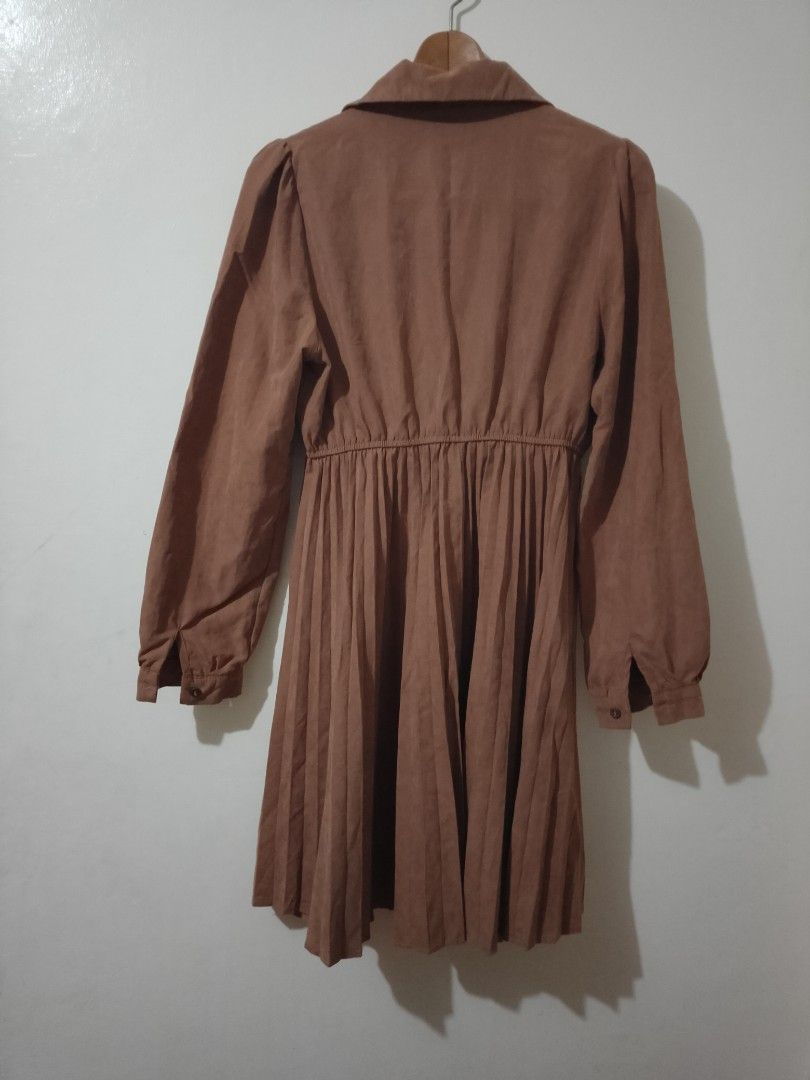 Brown Collared Button-Up Pleated Midi Dress (Category: Dresses) located in Cavite. Submitted by rodrycuteshop (Listing ID 1462646673, Image 2). Description: Regular selling price: 299 Now on sale! - Chic brown midi dress - Collared neckline with button-up front - Long sleeves with button cuffs - Elasticated waist for a comfortable fit - Flowy pleated skirt - Soft, comfortable fabric - Versatile for casual or semi-formal occasions - Effortless to 