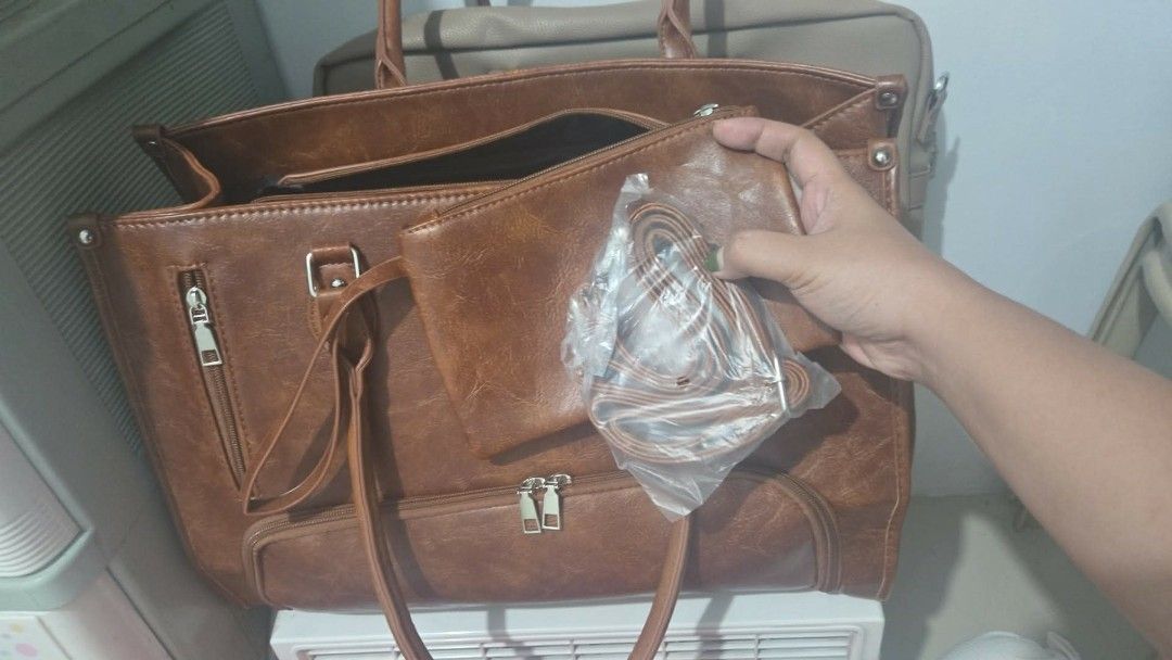 Brown Leather Tote Bag with Pouch and Strap (Category: Tote Bags) located in Manila. Submitted by a_angels (Listing ID 1462621066, Image 2). Description: 👜 Stylish Brown Tote Bag with Lunch Compartment ✨ Perfect for work, school, travel, and everyday use! Spacious main compartment for your essentials Separate bottom compartment for lunch/food Front zippered pocket for easy access Sturdy handles Adjustable/removable shoulder strap Stylish brown l