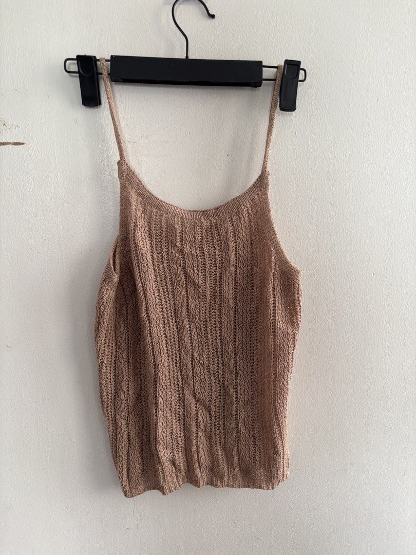 Brown Knit Spaghetti Strap Tank Top (Category: Sleeveless) located in Muntinlupa City. Submitted by jc444_ (Listing ID 1462602293, Image 1). Description: - Light brown knit tank top - Features spaghetti straps - Textured knit pattern - Fits like a size Small or Medium - Ideal for layering or wearing solo - Made with very breathable material.