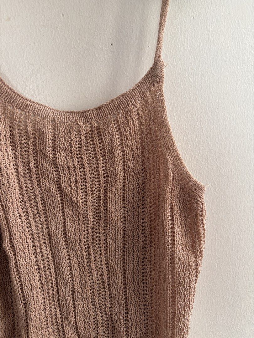 Brown Knit Spaghetti Strap Tank Top (Category: Sleeveless) located in Muntinlupa City. Submitted by jc444_ (Listing ID 1462602293, Image 2). Description: - Light brown knit tank top - Features spaghetti straps - Textured knit pattern - Fits like a size Small or Medium - Ideal for layering or wearing solo - Made with very breathable material.