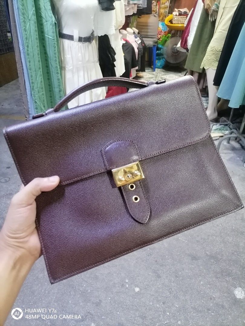 Brown Leather Briefcase "Made in Italy" (Category: Briefcases) located in Naga. Submitted by mrwisethrifter (Listing ID 1462581565, Image 1). Description: - Classic brown leather briefcase - Secure gold-tone clasp closure - Interior embossed "Made in Italy" - Sturdy and comfortable handle - Ideal for documents or a small laptop - Timeless design for professional use.