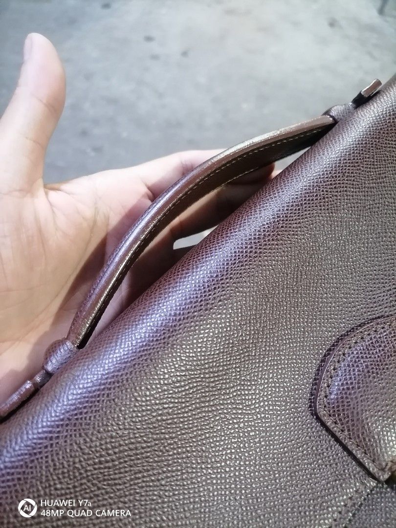 Brown Leather Briefcase "Made in Italy" (Category: Briefcases) located in Naga. Submitted by mrwisethrifter (Listing ID 1462581565, Image 2). Description: - Classic brown leather briefcase - Secure gold-tone clasp closure - Interior embossed "Made in Italy" - Sturdy and comfortable handle - Ideal for documents or a small laptop - Timeless design for professional use.