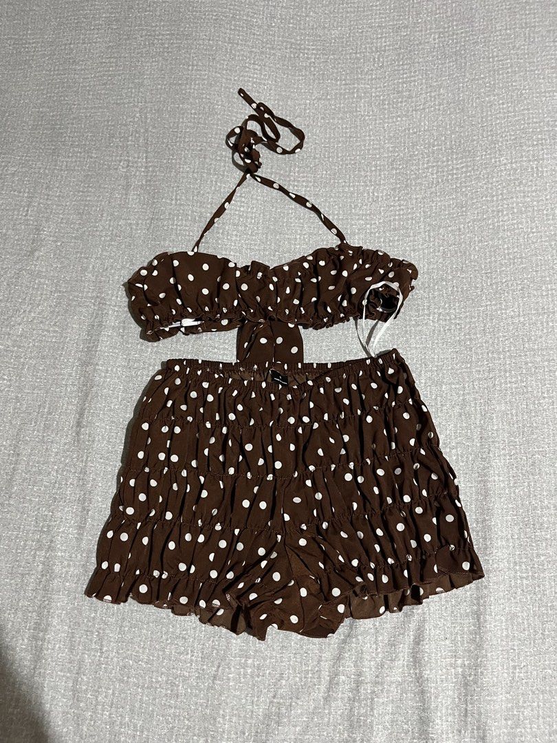 Brown polka dot set (Category: Bikinis & Swimsuits) located in Manila. Submitted by az0r_ (Listing ID 1462505498, Image 1). Description: - Cute brown polka dot bikini set - Includes halter top and ruffled shorts - Comes with a matching white button-up shirt - Lightweight and flowy fabric - Ideal for beach days and summer vibes.