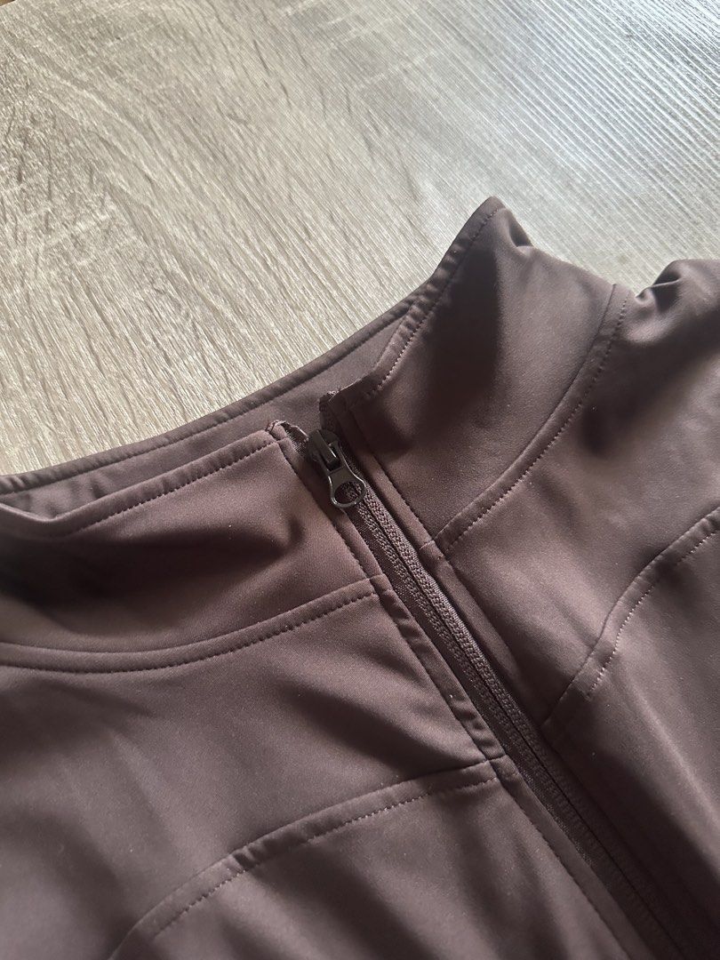 Brown Zip-Up Jacket for workouts (Category: Coats, Jackets and Outerwear) located in Cainta. Submitted by thingsfromerika (Listing ID 1462473205, Image 2). Description: - Brown long-sleeve jacket - Zip-up front with high neck - Made from a comfortable and stretchy polyester/spandex blend - Ideal for workouts or casual wear - Fits size Medium.