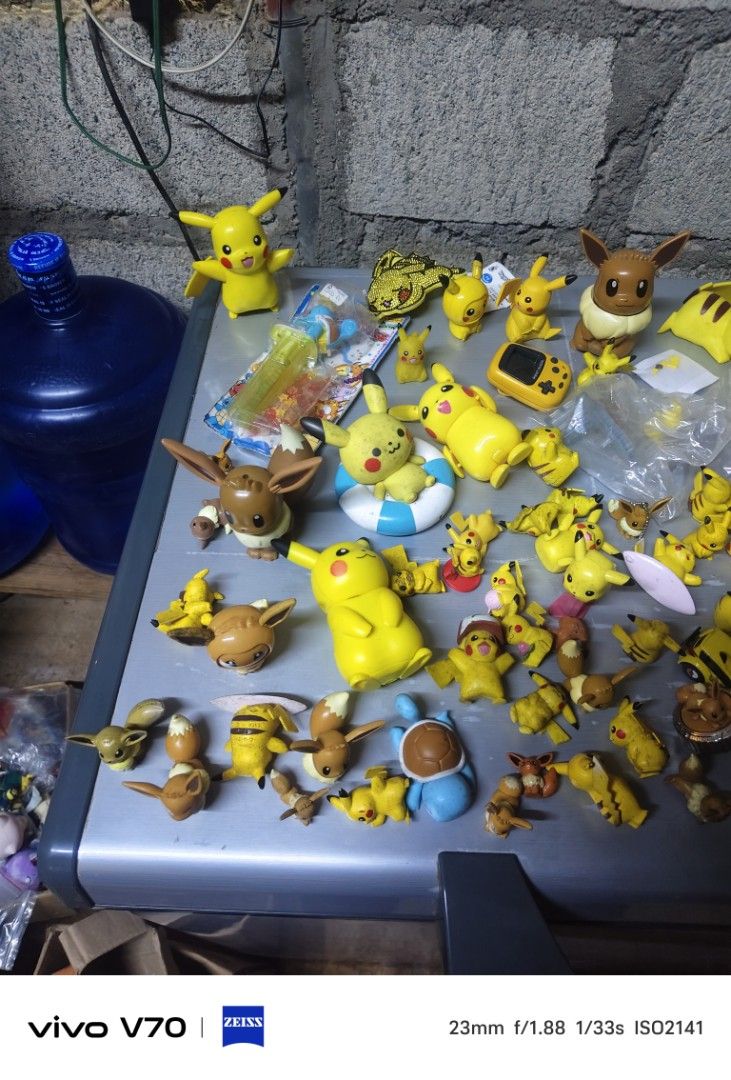 Bulk Pokemon Figurines - Pikachu, Eevee, and more! (Category: Figurines & Statues) located in Kapangan. Submitted by ClumZyDale (Listing ID 1462574582, Image 1). Description: - Assorted Pokemon figurines for sale. - Features multiple Pikachus in different poses. - Includes Eevees and other popular Pokemon characters. - Figures come in various sizes, from small to larger. - Ideal for any Pokemon enthusiast or collector. - price varies from 100 and