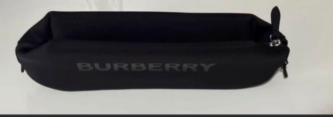 Burberry Black Pouch Cosmetic Bag (Category: Luxury Bags & Wallets) located in Pasay City. Submitted by szepter (Listing ID 1462444315, Image 2). Description: - Authentic Burberry pouch in classic black. - Ideal for organizing makeup, toiletries, or travel essentials. - Secure zipper closure with two convenient pulls. - Made from a soft, durable material resembling neoprene. - Features a subtle, embossed Burberry logo on the front. - Approximate 