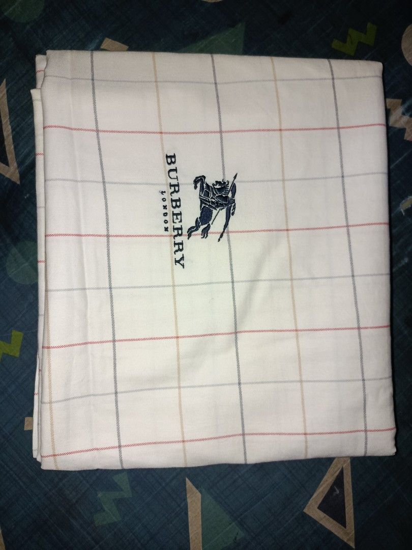 Burberry London blanket (Category: Bedding & Towels) located in Nabunturan. Submitted by marmitoren42236 (Listing ID 1462670882, Image 3). Description: - Authentic Burberry London blanket - Classic checkered pattern - Embroidered Burberry logo - Made of 100% soft and absorbent cotton - Perfect for everyday use or as a stylish decor - Approximate dimensions: 4ftx8ft - Feel free to send a message with any questions!.