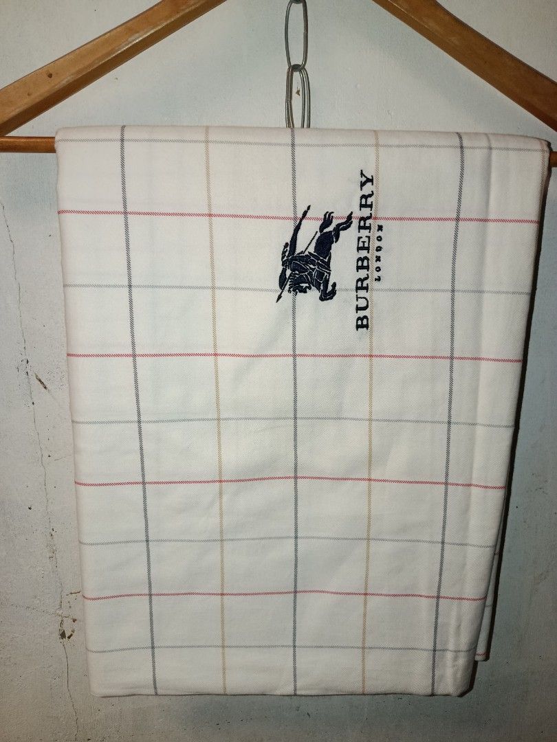 Burberry London blanket (Category: Bedding & Towels) located in Nabunturan. Submitted by marmitoren42236 (Listing ID 1462670882, Image 1). Description: - Authentic Burberry London blanket - Classic checkered pattern - Embroidered Burberry logo - Made of 100% soft and absorbent cotton - Perfect for everyday use or as a stylish decor - Approximate dimensions: 4ftx8ft - Feel free to send a message with any questions!.