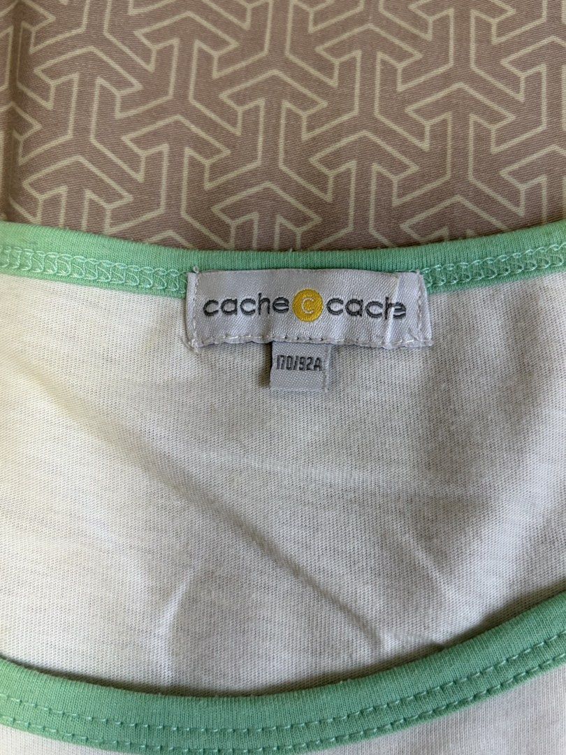 Cache Cache Penguin "Endless Summer Day" T-shirt (Category: Blouses) located in Manila. Submitted by shopmeph (Listing ID 1462650779, Image 2). Description: - Adorable white t-shirt with a charming penguin graphic. - Features the text "Endless Summer Day". - Stylish light green raglan sleeves and neckline. - Made from soft fabric for ultimate comfort. - Relaxed fit, perfect for everyday casual wear..