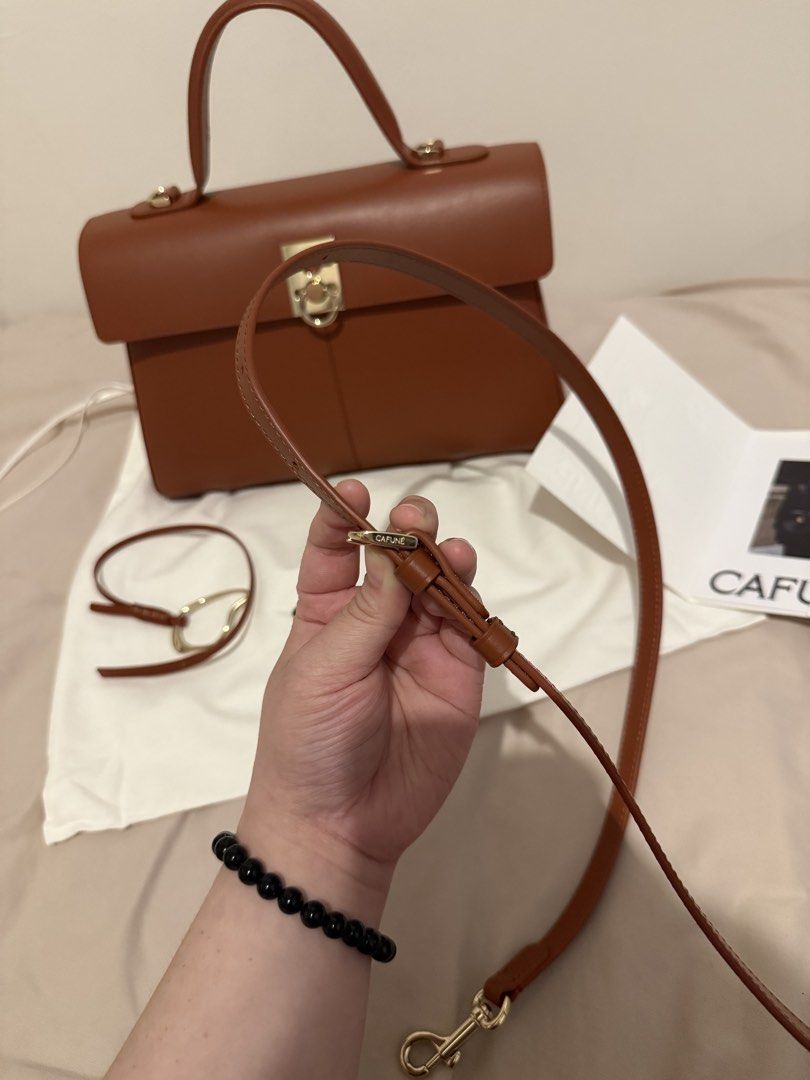 Cafune Stance Bag in Terracotta (Category: Luxury Bags & Wallets) located in Taguig. Submitted by kirei.retro (Listing ID 1462595445, Image 2). Description: 𝐂𝐚𝐟𝐮𝐧𝐞 𝐒𝐭𝐚𝐧𝐜𝐞 𝐁𝐚𝐠 𝐢𝐧 𝐓𝐞𝐫𝐫𝐚𝐜𝐨𝐭𝐭𝐚 🏷️₱𝟓𝟐,𝟎𝟎𝟎 - comes complete with dust bag, strap, bag charm, and authenticity certificate - never used, just kept in storage - currently retail price is ₱56,900.