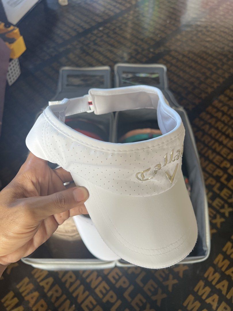 Callaway White Golf Visor with Perforated Detail (Category: Caps & Hats) located in Davao. Submitted by dubdabi.co (Listing ID 1462461870, Image 2). Description: - White Callaway golf visor - Perforated detailing on the front panel - Adjustable strap for a comfortable fit - Ideal for sunny days on the golf course - Classic and simple design.