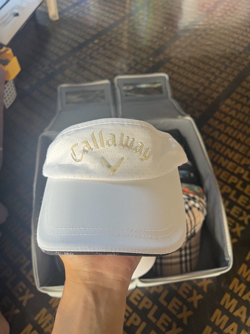 Callaway White Golf Visor with Perforated Detail (Category: Caps & Hats) located in Davao. Submitted by dubdabi.co (Listing ID 1462461870, Image 1). Description: - White Callaway golf visor - Perforated detailing on the front panel - Adjustable strap for a comfortable fit - Ideal for sunny days on the golf course - Classic and simple design.