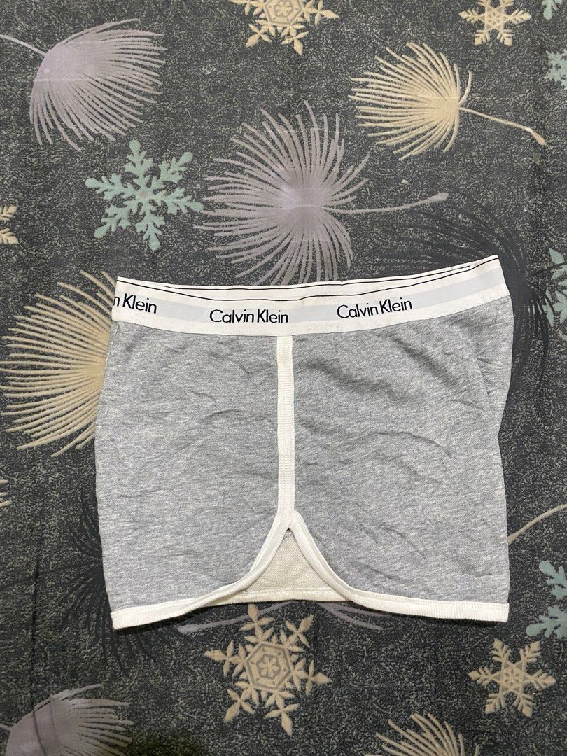 Calvin Klein Jeans Grey Lounge Shorts (Category: Shorts) located in Davao. Submitted by brandedthrift.134 (Listing ID 1462473652, Image 2). Description: - Brand: Calvin Klein Jeans - Color: Grey - Type: Lounge Shorts - Size: Medium (M) - Material: Comfortable cotton blend - Features: Elastic waistband with repeated logo - Ideal for: Lounging at home or casual wear.