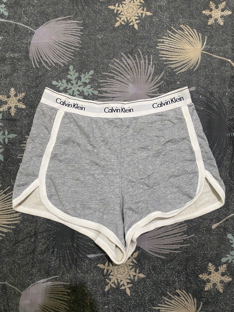 Calvin Klein Jeans Grey Lounge Shorts (Category: Shorts) located in Davao. Submitted by brandedthrift.134 (Listing ID 1462473652, Image 1). Description: - Brand: Calvin Klein Jeans - Color: Grey - Type: Lounge Shorts - Size: Medium (M) - Material: Comfortable cotton blend - Features: Elastic waistband with repeated logo - Ideal for: Lounging at home or casual wear.