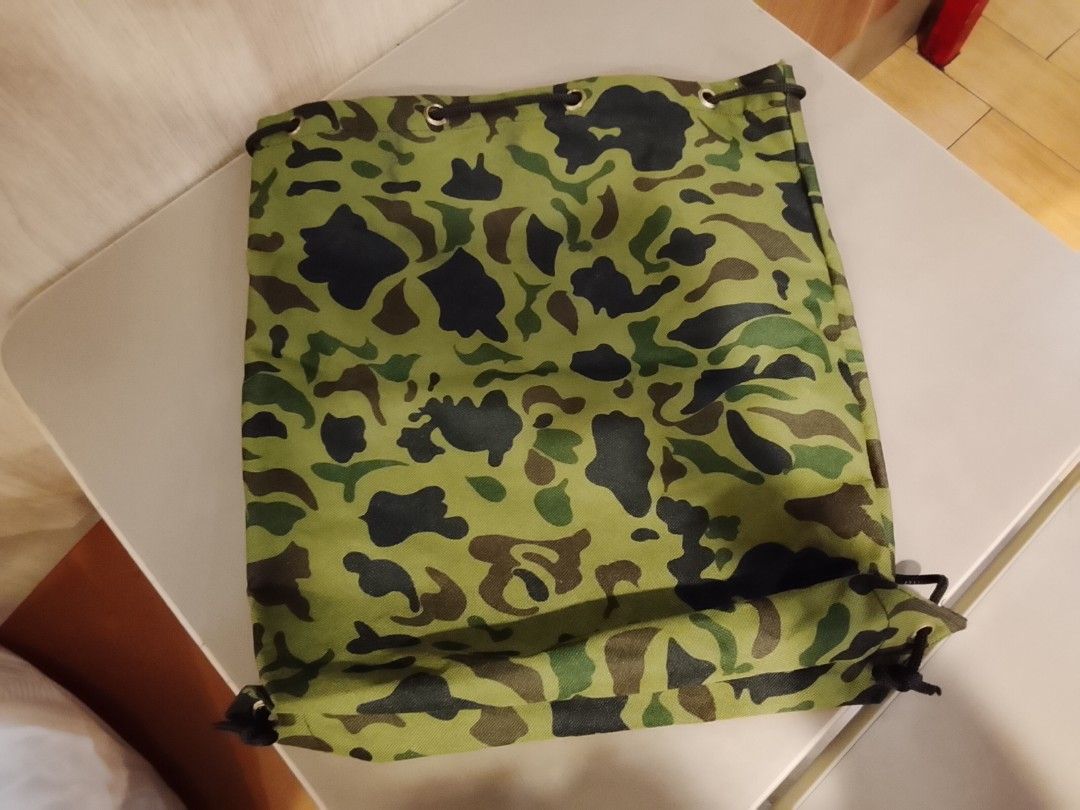 Camouflage pattern drawstring bag (Category: Backpacks) located in Manila. Submitted by newage.vintage (Listing ID 1462501699, Image 2). Description: - excellent condition -no issue - from Japan surplus - length 44cm - width 34cm.