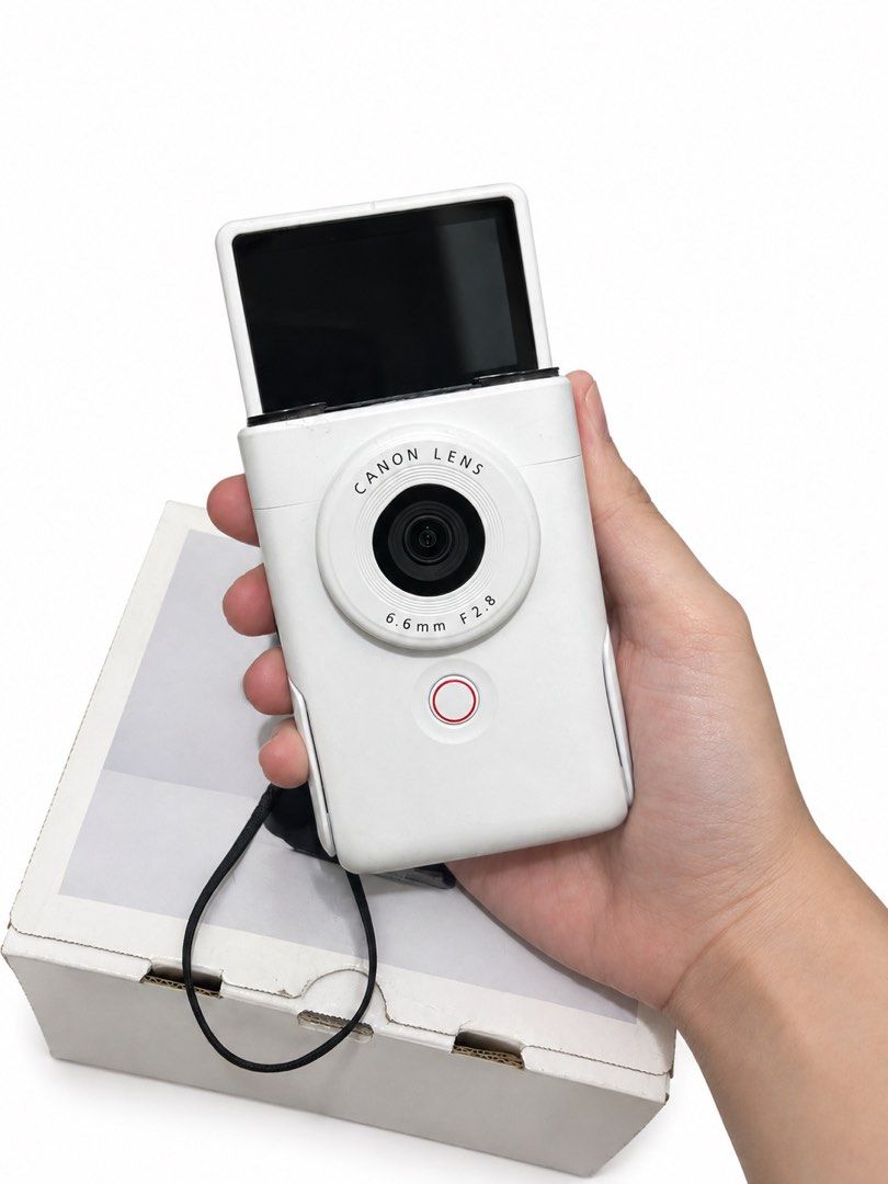 Canon Powershot V10 (Category: Cameras) located in Manila. Submitted by mijareszophia8 (Listing ID 1462610755, Image 3). Description: ★ Canon PowerShot V10 WHITE! 📸 ╰─➤ ₱15,999! FIXED ✨ COMPACT VLOGGING CAMERA! 🔥 ✨ COMPLETE SET • READY TO USE ✨ Body condition: Can pass as brand new! ✨ 📸 Specs: • 20.9MP CMOS Sensor • 4K UHD Video Recording • 19mm Wide-Angle Lens • Built-in Stereo Microphones • 3.0” Touchscreen LCD • Built-in Kickstand • Vertica