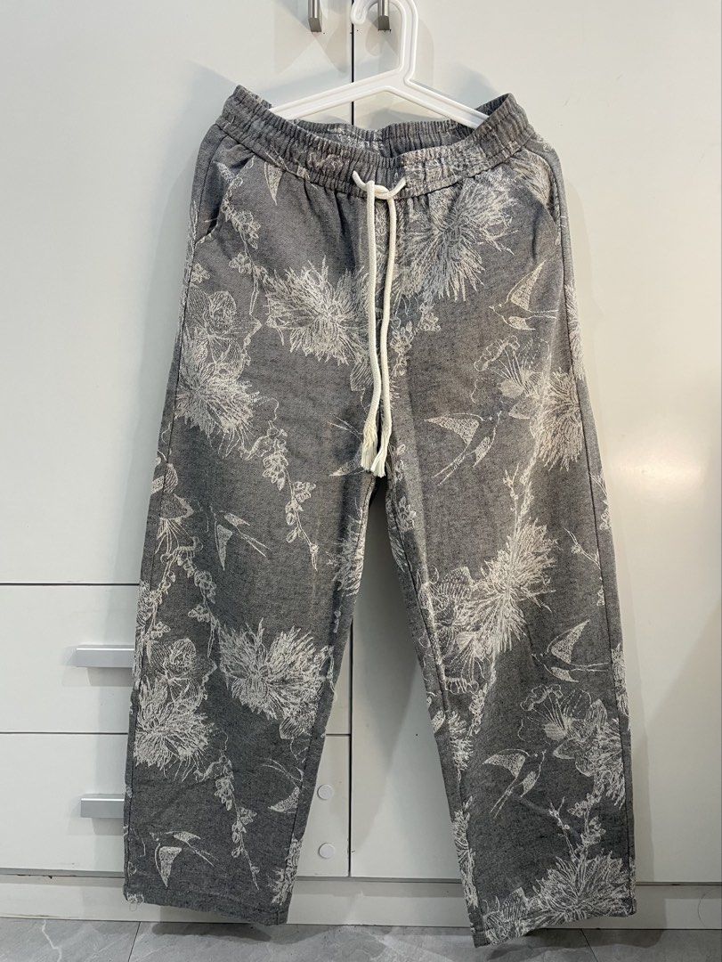 Canvas Style Grey White Designed Pants (Category: Joggers) located in Manila. Submitted by raine.star (Listing ID 1462517523, Image 1). Description: Canvas style, grey and white, flower detailed design.