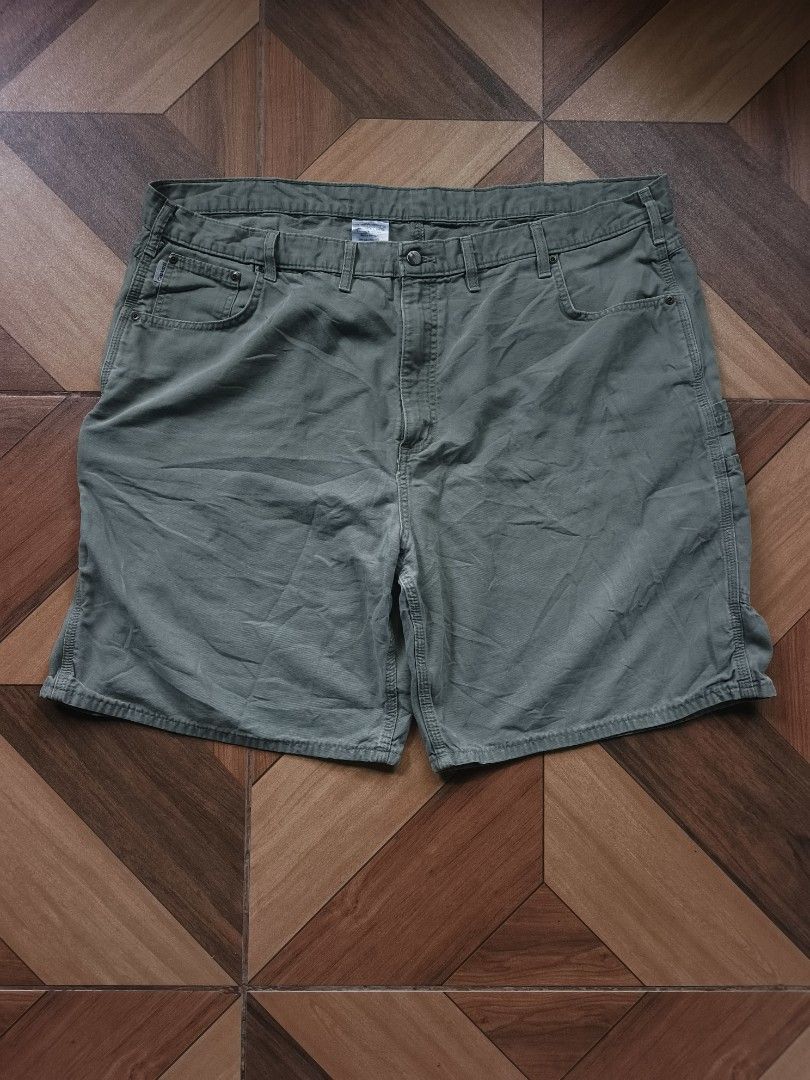 Carhartt B190 LDN Carpenter Short (Category: Shorts) located in Zamboanga. Submitted by d2977250664046 (Listing ID 1462539296, Image 1). Description: - Brand: Carhartt - Size 40 on tag 44x23 dimes - Color: Khaki Green - Material: 100% Cotton Durable Canvas - Features: Multiple pockets, including a right leg cargo pocket - Closure: Button and zip fly - Ideal for: Workwear, everyday wear - Excellent Condition .