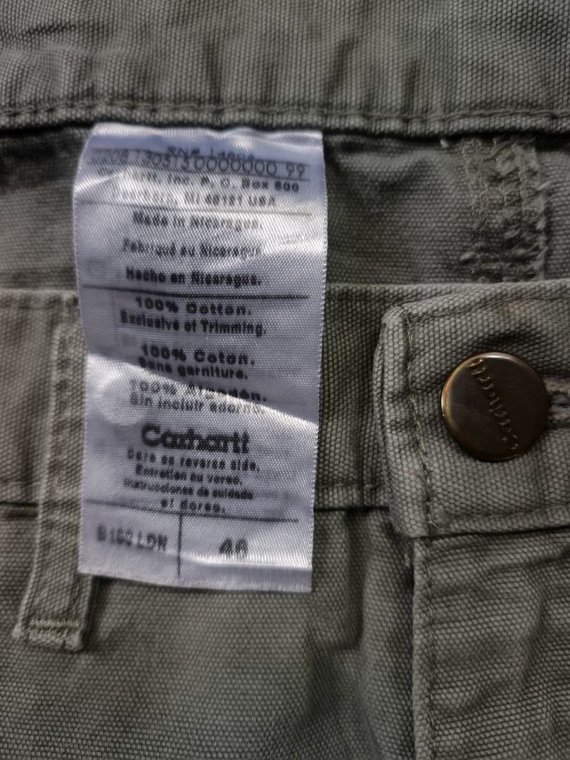 Carhartt B190 LDN Carpenter Short (Category: Shorts) located in Zamboanga. Submitted by d2977250664046 (Listing ID 1462539296, Image 3). Description: - Brand: Carhartt - Size 40 on tag 44x23 dimes - Color: Khaki Green - Material: 100% Cotton Durable Canvas - Features: Multiple pockets, including a right leg cargo pocket - Closure: Button and zip fly - Ideal for: Workwear, everyday wear - Excellent Condition .