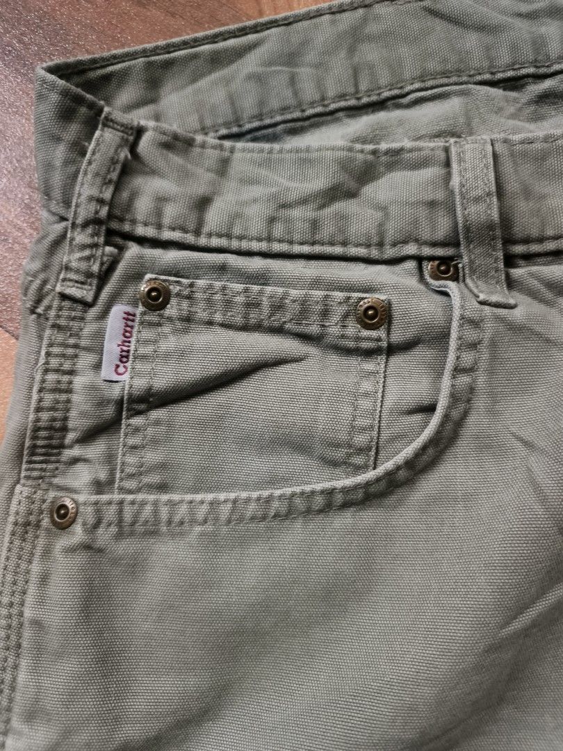 Carhartt B190 LDN Carpenter Short (Category: Shorts) located in Zamboanga. Submitted by d2977250664046 (Listing ID 1462539296, Image 2). Description: - Brand: Carhartt - Size 40 on tag 44x23 dimes - Color: Khaki Green - Material: 100% Cotton Durable Canvas - Features: Multiple pockets, including a right leg cargo pocket - Closure: Button and zip fly - Ideal for: Workwear, everyday wear - Excellent Condition .
