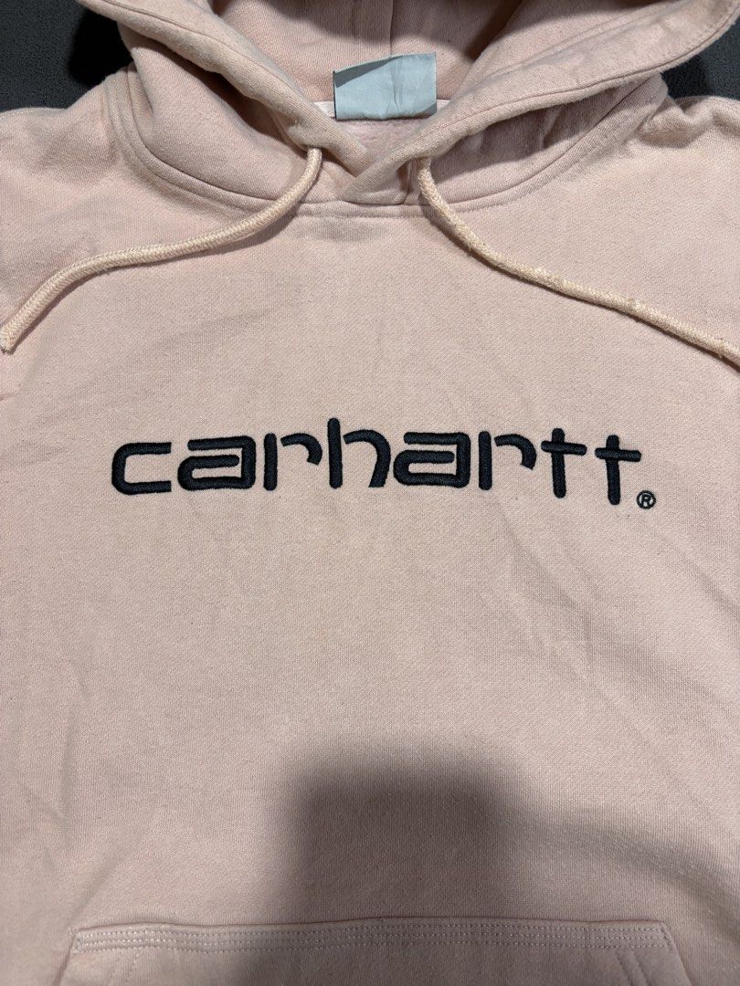 Carhartt Work In Progress Hoodie Pink Size S (Category: Coats, Jackets and Outerwear) located in Mabalacat. Submitted by _limitlessfashion (Listing ID 1462475844, Image 2). Description: - Pink Carhartt WIP hoodie - Features iconic Carhartt WIP logo on the front - Length 25 - Width 22 - Comfortable pullover style - Includes a convenient front pocket - Attached hood for extra warmth and style - Ideal for everyday casual wear - Size: Small (S).