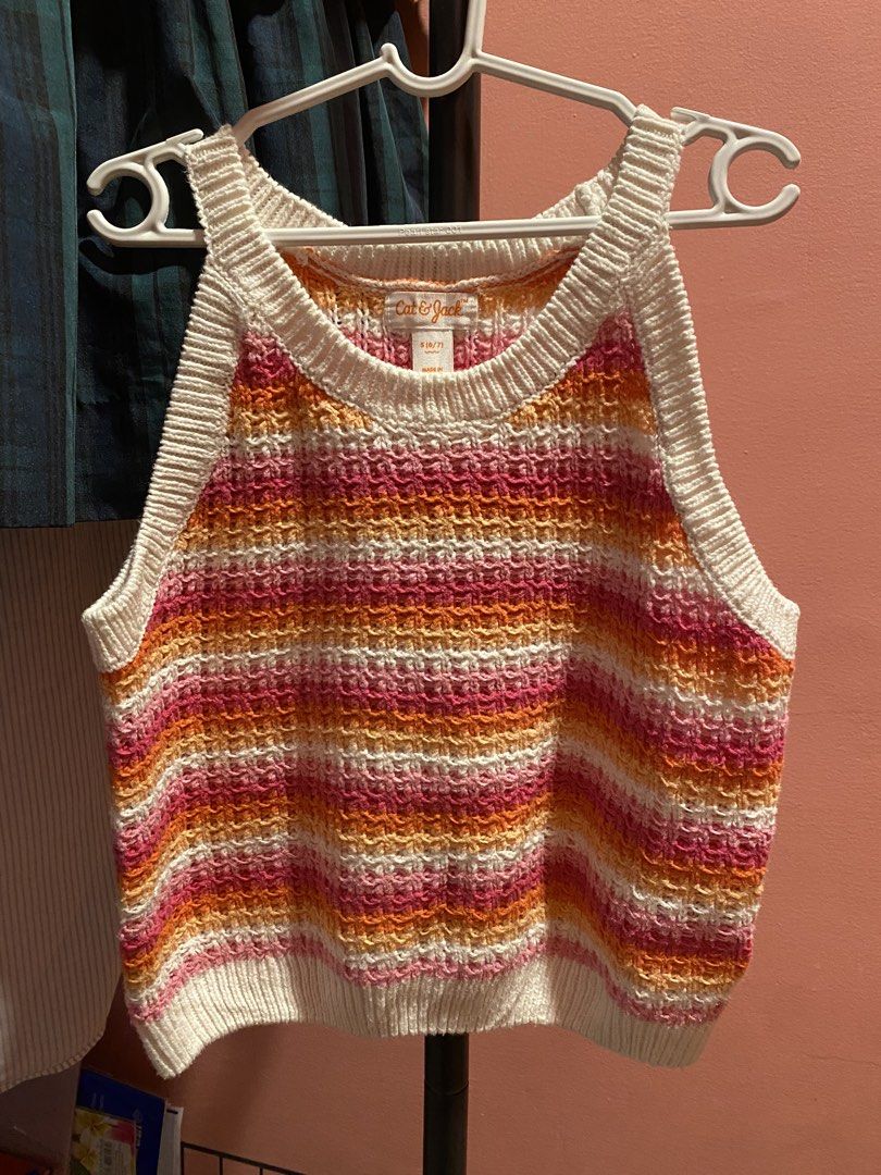 Cat & Jack Striped Knit Tank Top Size S (6/7) (Category: Babies & Kids Fashion) located in Imus. Submitted by findsbychii (Listing ID 1462590821, Image 1). Description: - Cute striped knit tank top from Cat & Jack - Features pink, orange, and white stripes - Textured weave for added detail - Ribbed neckline and hem - Sleeveless design, ideal for warm weather.