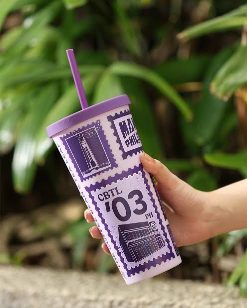 CBTL '03 PH Tumbler with Straw (Category: Water Bottles & Tumblers) located in Pasay City. Submitted by kimricasa (Listing ID 1462675338, Image 1). Description: - Eye-catching purple tumbler with a unique stamp design. - Features 'CBTL '03 PH' and a building graphic. - Comes with a matching purple straw. - Ideal for your favorite iced drinks or coffee on the go. - A distinctive piece you won't find everywhere!.