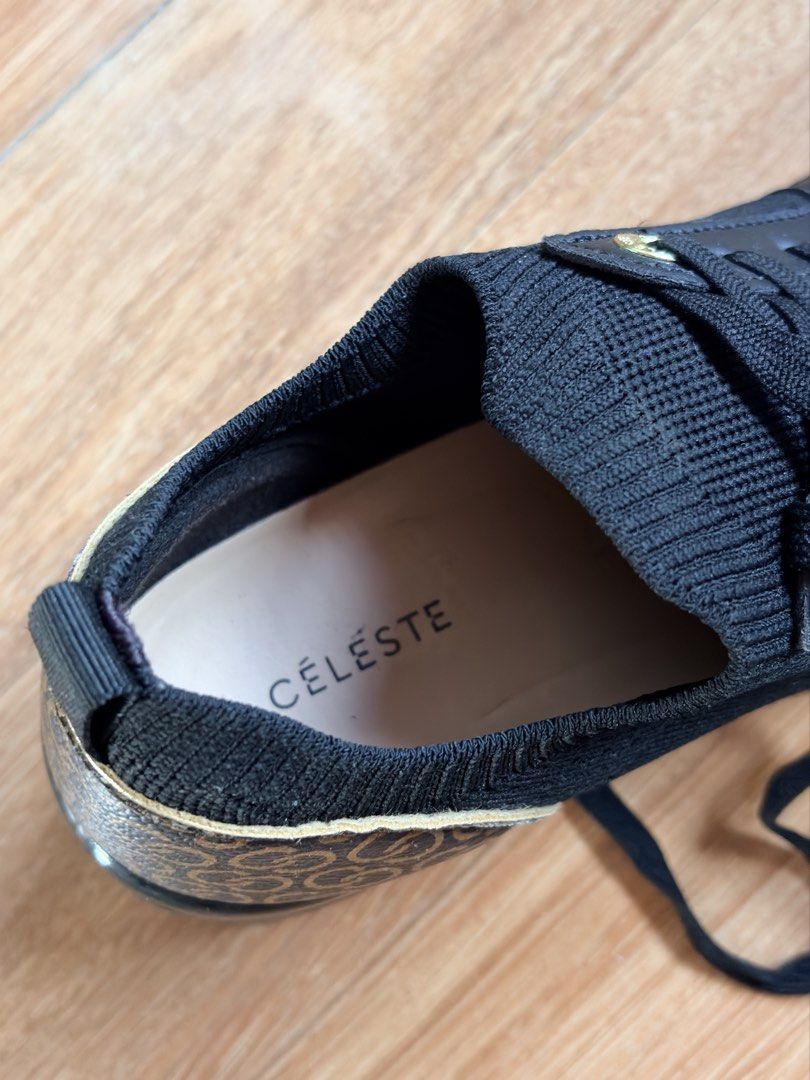 Celeste Wedge Sneakers EUR 38 (Category: Sneakers) located in Tabaco. Submitted by shae_3 (Listing ID 1462491266, Image 3). Description: - Stylish black Celeste sneakers with a hidden wedge heel. - Features the iconic Celeste logo pattern on the sides and heel. - Secure lace-up front for a perfect fit. - Size: EUR 38 - Origin: Made in China.