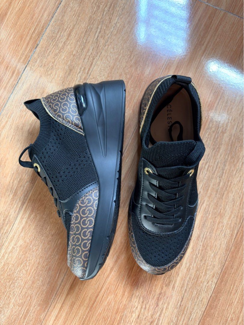 Celeste Wedge Sneakers EUR 38 (Category: Sneakers) located in Tabaco. Submitted by shae_3 (Listing ID 1462491266, Image 1). Description: - Stylish black Celeste sneakers with a hidden wedge heel. - Features the iconic Celeste logo pattern on the sides and heel. - Secure lace-up front for a perfect fit. - Size: EUR 38 - Origin: Made in China.