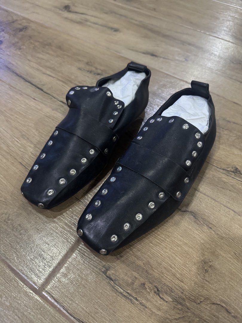 Celine Black Leather Studded Square Toe Flats Size 38 (Category: Flats & Sandals) located in Quezon City. Submitted by eyabanana08 (Listing ID 1462595724, Image 2). Description: - Celine Black Leather Flats - Size: 38 - Features: Silver stud details all around, strap across vamp - Design: Square toe - Origin: Made in Italy - Condition: Soles show wear from use - Includes: Original box and dust bag - authentic .