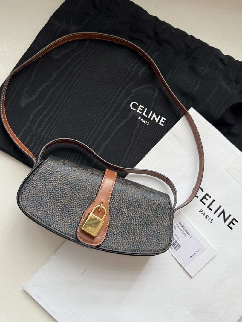 Celine Triomphe Shoulder Bag (Category: Luxury Bags & Wallets) located in Pasay City. Submitted by shop.stylestaple (Listing ID 1462508746, Image 1). Description: - Authentic Celine shoulder bag (Tabou) - Triomphe canvas in brown and tan - Features a gold lock closure - Adjustable strap for comfort - Interior slip pocket - Comes with dust bag and authenticity card - Made in Italy CLUTCH ON STRAP TABOU IN TRIOMPHE CANVAS AND CALFSKIN TAN 7 X 3 X 2