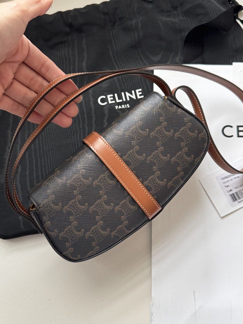 Celine Triomphe Shoulder Bag (Category: Luxury Bags & Wallets) located in Pasay City. Submitted by shop.stylestaple (Listing ID 1462508746, Image 3). Description: - Authentic Celine shoulder bag (Tabou) - Triomphe canvas in brown and tan - Features a gold lock closure - Adjustable strap for comfort - Interior slip pocket - Comes with dust bag and authenticity card - Made in Italy CLUTCH ON STRAP TABOU IN TRIOMPHE CANVAS AND CALFSKIN TAN 7 X 3 X 2
