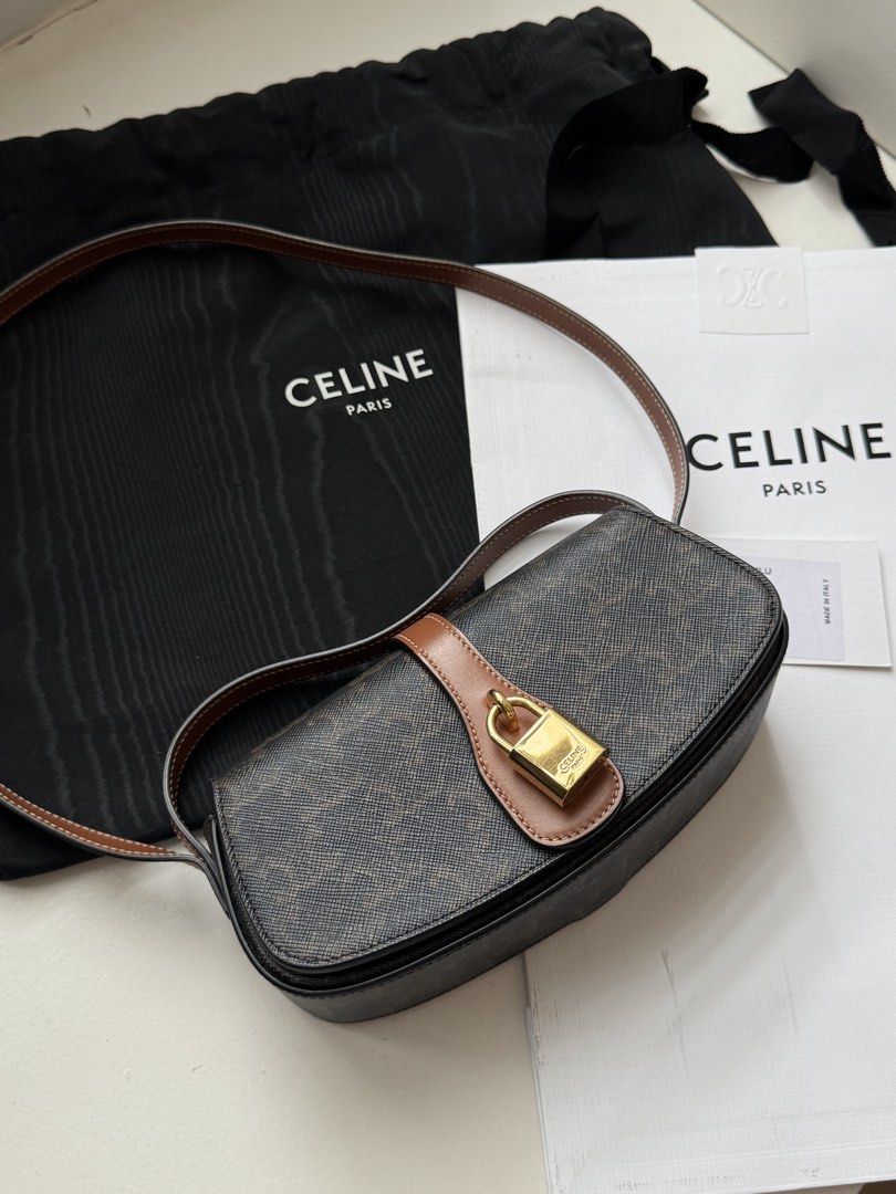 Celine Triomphe Shoulder Bag (Category: Luxury Bags & Wallets) located in Pasay City. Submitted by shop.stylestaple (Listing ID 1462508746, Image 2). Description: - Authentic Celine shoulder bag (Tabou) - Triomphe canvas in brown and tan - Features a gold lock closure - Adjustable strap for comfort - Interior slip pocket - Comes with dust bag and authenticity card - Made in Italy CLUTCH ON STRAP TABOU IN TRIOMPHE CANVAS AND CALFSKIN TAN 7 X 3 X 2