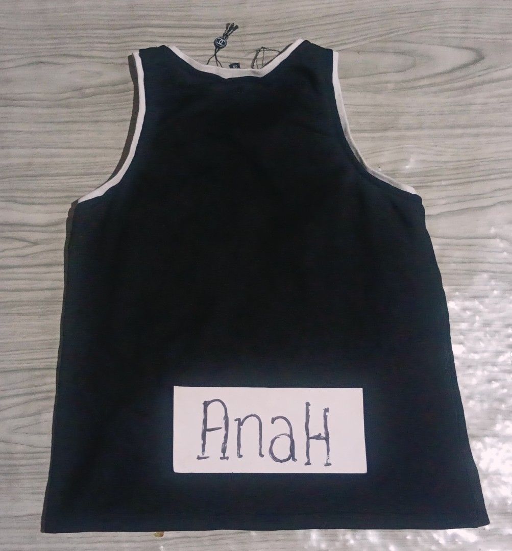 Chanel Black Tank Top with '5' Graphic (Category: Sleeveless) located in Valenzuela. Submitted by AnahThrift (Listing ID 1462461938, Image 2). Description: - Tank Top - Features iconic '5' graphic on front - Iconic Chanel CC logo detail - Made in Italy - Size: 38 - Perfect for any fashion lover.