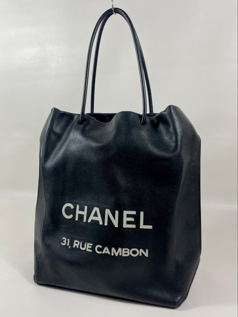 CHANEL RUE CAMBON TOTE BAG (Category: Luxury Bags & Wallets) located in San Fernando. Submitted by larchivefeminine (Listing ID 1462649256, Image 3). Description: CHANEL RUE CAMBON TOTE BAG IN VERY GOOD CONDITION SS / 2009 MADE IN ITALY COLOR:BLACK / LEATHER MATERIAL: SMOOTH,SOFT CALFSIN / BLACK AND WHITE CANVAS FABRIC LINING/ ONE INTEGRATED ZIP POCKET .