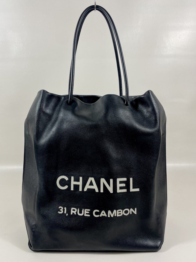 CHANEL RUE CAMBON TOTE BAG (Category: Luxury Bags & Wallets) located in San Fernando. Submitted by larchivefeminine (Listing ID 1462649256, Image 1). Description: CHANEL RUE CAMBON TOTE BAG IN VERY GOOD CONDITION SS / 2009 MADE IN ITALY COLOR:BLACK / LEATHER MATERIAL: SMOOTH,SOFT CALFSIN / BLACK AND WHITE CANVAS FABRIC LINING/ ONE INTEGRATED ZIP POCKET .