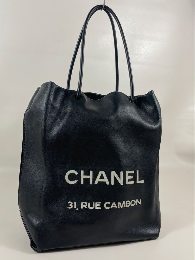 CHANEL RUE CAMBON TOTE BAG (Category: Luxury Bags & Wallets) located in San Fernando. Submitted by larchivefeminine (Listing ID 1462649256, Image 2). Description: CHANEL RUE CAMBON TOTE BAG IN VERY GOOD CONDITION SS / 2009 MADE IN ITALY COLOR:BLACK / LEATHER MATERIAL: SMOOTH,SOFT CALFSIN / BLACK AND WHITE CANVAS FABRIC LINING/ ONE INTEGRATED ZIP POCKET .