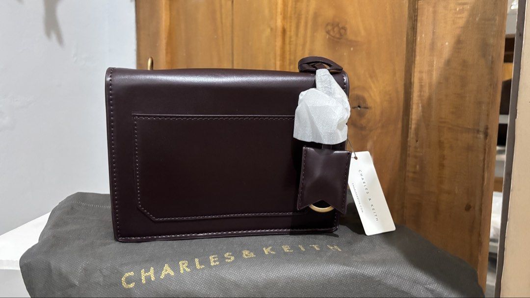 Charles & Keith Front Flap Structured Cross Body Bag (Category: Cross-body Bags) located in General Santos City (Dadiangas). Submitted by kuhreenjoy (Listing ID 1462610158, Image 2). Description: Brand New / Never been used, but has a few minor scratches from storage. Please see photos for the actual condition..