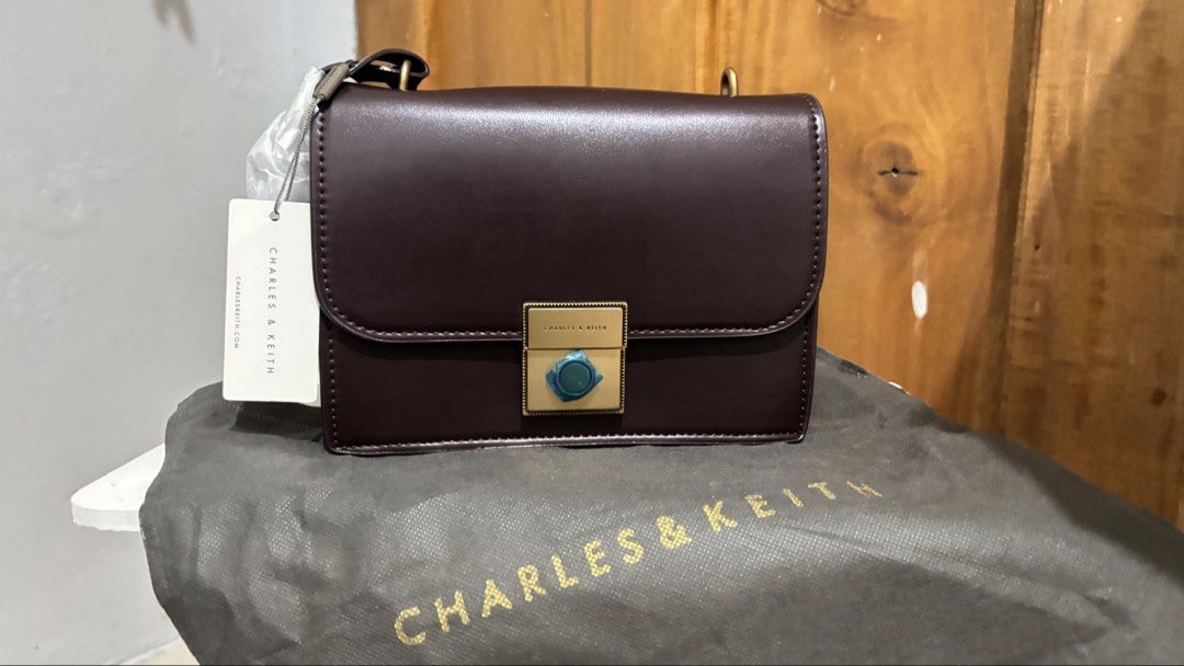 Charles & Keith Front Flap Structured Cross Body Bag (Category: Cross-body Bags) located in General Santos City (Dadiangas). Submitted by kuhreenjoy (Listing ID 1462610158, Image 1). Description: Brand New / Never been used, but has a few minor scratches from storage. Please see photos for the actual condition..