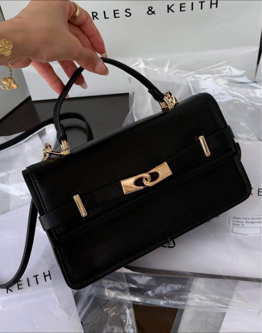 Charles & Keith Top Handle Bag (Category: Luxury Bags & Wallets) located in Manila. Submitted by sy_str (Listing ID 1462469034, Image 2). Description: ARLET BELTED TOP HANDLE BAG Available Colors: 🍷 Wineberry Red 🖤 Black 🤍 Cream 🤎 Brown Elegant and versatile top-handle bag Perfect for everyday wear or special occasions Price: ₱P1899 Add ₱70 for the paper bag. 📦 Shipping: 2–4 days processing 📍 Shipping within Metro Manila 💳 Payment first to