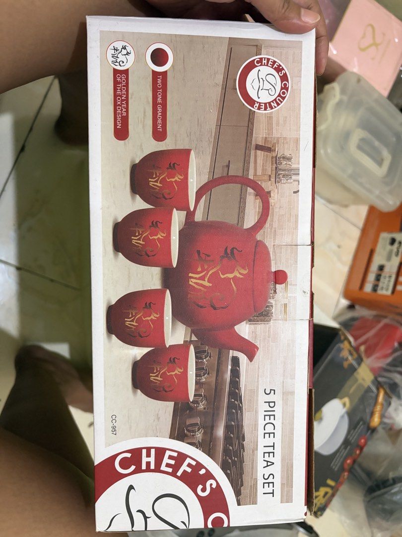Chef's Counter 5 Piece Red Tea Set (Category: Coffee & Tea Tableware) located in Rosario. Submitted by damor222 (Listing ID 1462523326, Image 2). Description: - Red tea set with sophisticated gold accents. - Complete set includes 1 teapot and 4 cups. - Perfect for serving your favorite teas. - Arrives in its original packaging. - Features an attractive two-tone gradient design..