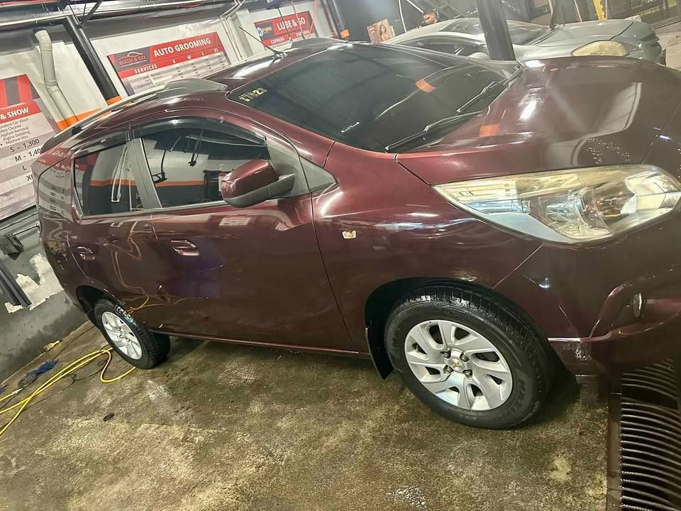 Chevrolet Spin LTZ Auto (Category: Used Cars) located in Caloocan City. Submitted by monchiebebe519 (Listing ID 1462447570, Image 3). Description: Top of the Line Chevrolet Spin LTZ automatic with manual mode, 6- 8 seater, foldable 3rd row seat, 1.5 petrol-fed engine, legit 46K mileage, with 2-way RF ids, very cold a/c system with mid-cabin vent, imported thick tires, 7" android infotainment unit, led fog lites, with roof carrier, almost new batt