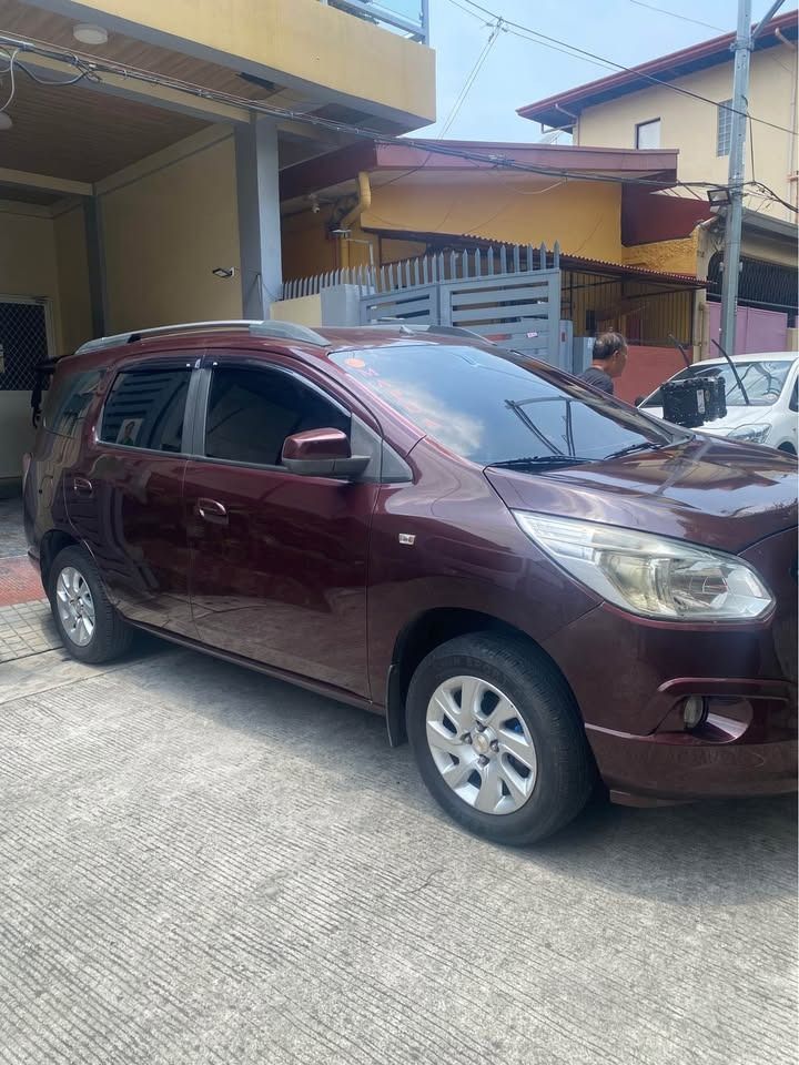 Chevrolet Spin LTZ Auto (Category: Used Cars) located in Caloocan City. Submitted by monchiebebe519 (Listing ID 1462447570, Image 2). Description: Top of the Line Chevrolet Spin LTZ automatic with manual mode, 6- 8 seater, foldable 3rd row seat, 1.5 petrol-fed engine, legit 46K mileage, with 2-way RF ids, very cold a/c system with mid-cabin vent, imported thick tires, 7" android infotainment unit, led fog lites, with roof carrier, almost new batt
